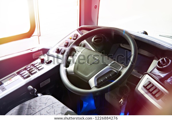 Driver seat and steering wheel with the dashboard of\
the bus