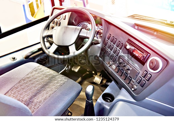 Driver seat and steering wheel with the dashboard of\
the bus