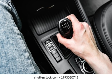 Driver shifting the gear on car manual gearbox. - Shutterstock ID 1993030745