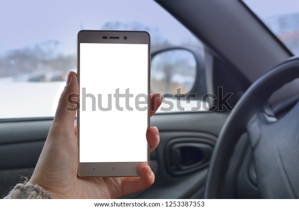 the
driver is sitting in the car with a mobile
phone