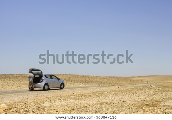 Driver\
Stuck on the Side of the Road at Negev,\
Israel
