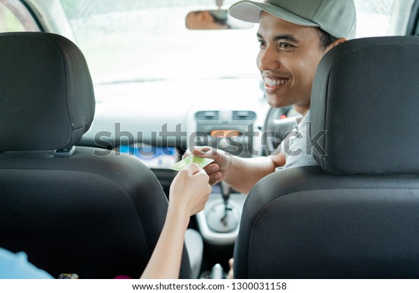 a driver taxi receive payment using a credit card in\
a big city