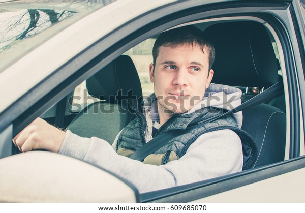 Driver thinking\
inside the car. Safe\
driving.