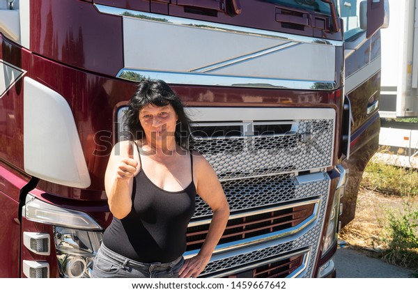 Driver of a truck shows thumbs
up