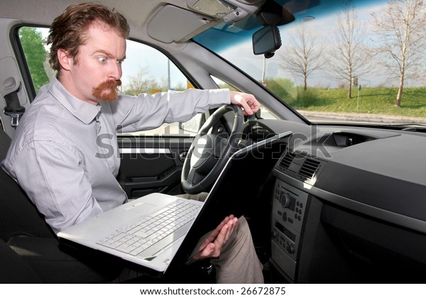 driver using gps\
laptop computer in a car