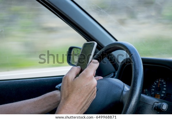 Driver using mobile\
device