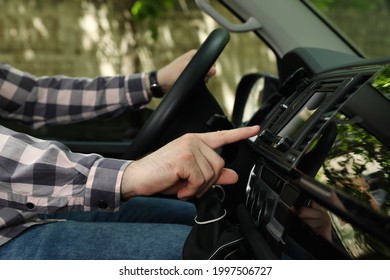 Driver using modern car navigation system, closeup