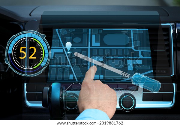 Driver using\
modern car navigation system,\
closeup