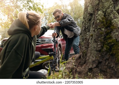 Driver While Parking Knocked Down Woman On Bicycle Crash Car Accident. Man Helps Girl To Get Up After Fall.