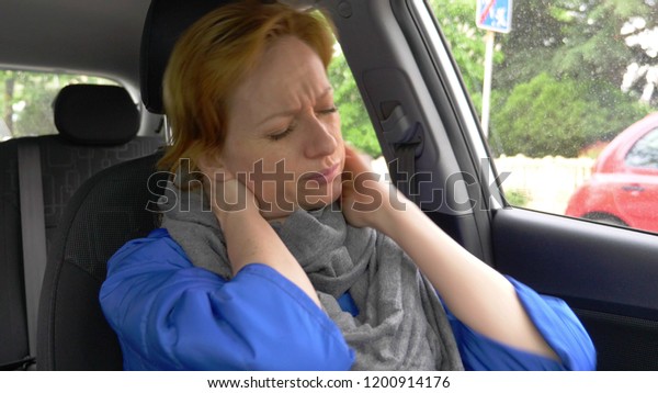 the driver of the woman\
fell asleep on the driver\'s seat on the side of the road. Waiting\
in the car.