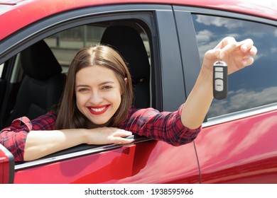 Driver Woman Smiling Showing New Car Keys And Car. Happy Woman Driver Showing Car Keys And Leaning On Car Door