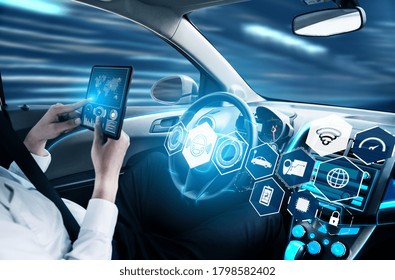 Driverless Car Interior With Futuristic Dashboard For Autonomous Control System . Inside View Of Cockpit HUD Technology Using AI Artificial Intelligence Sensor To Drive Car Without People Driver .