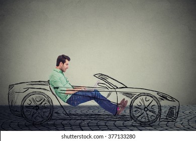 Driverless Self Driving Car Technology Concept. Side Profile Young Handsome Man Using Laptop Computer While Driving A Car