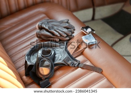 Drivers accessories left on the front seat of the vintage car