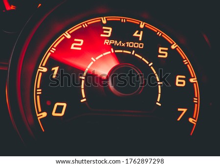 Driver's cockpit ; speedometer on dashboard - colorful light in black, copy space for your abstract design	