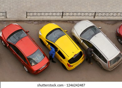 Drivers Get Out Of Their Colorful Cars. Cars Parked On A City Street. Car Background. Parking Problem