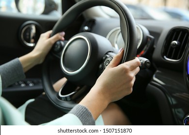 Driver's Hands On A Car Steering Wheel