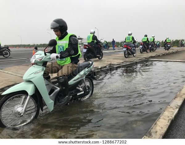 At driver\'s license school, Vinh Phuc\
province, Vietnam - January 11, 2019: A1-level students are\
practicing driving\
motorbikes