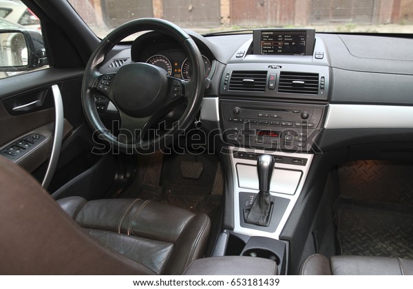 driver\'s seat and the car control panel, steering\
wheel and control\
devices
