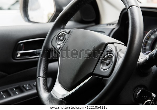 driver\'s seat of the car. Interior of the car.\
Black interior