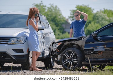 Drivers of smashed vehicles arguing who is guilty in car crash accident on street side. Road safety and insurance concept.