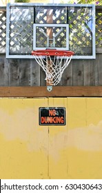 Driveway Basketball Backboard, Hoop, And Net With NO DUNKING Sign. Vertical.