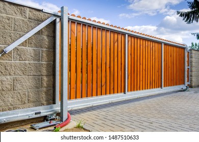 Driveway And Estate Gate. New Automatic Gate During Installation.  Automatic Also Cantilever Wooden Gate With Metal Frame.  Toothed Rack And Cables Are Already Ready.