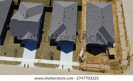 Driveway framing and small utility structure under assembly at corner house in Highpointe Ranch along US 377 and Blackjack Rd. Shingle textures, rebar grids, and curved street lines, Aubrey, TX. USA