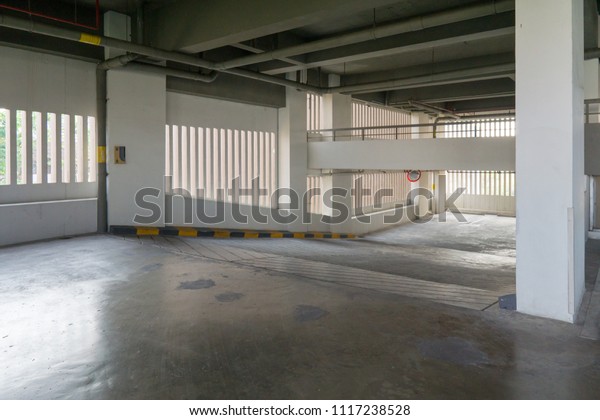 Driveway up\
to a parking garage in a office\
building