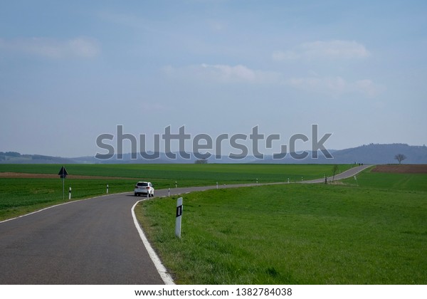 Driving along the road\
in spring in Wierschem, Germany. The route goes to Eltz castle.\
Road trip in Europe.