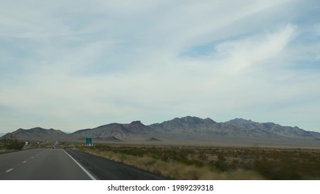 Driving Auto, Route To Las Vegas, Nevada USA. Road Trip From Grand Canyon, Arizona. Hitchhiking Traveling In America, Wild West Indian Lands, Desert And Mountains Journey. Wilderness Thru Car Window.