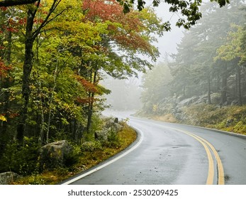 Driving up Cadillac Mountain in Acadia National Park on an autumn morning, the fog hung in the air like a blanket, adding an air of mystery to the beautiful ascent - Powered by Shutterstock