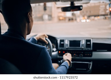 Driving a car in city. Man driving his modern van at the city - Powered by Shutterstock