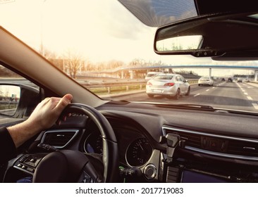 Driving a car in the city on a sunny day - Powered by Shutterstock