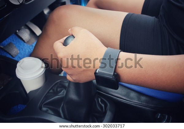  Driving car with\
coffee paper cup