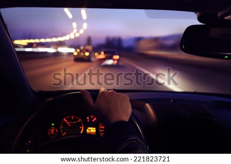 Driving car during sunrise