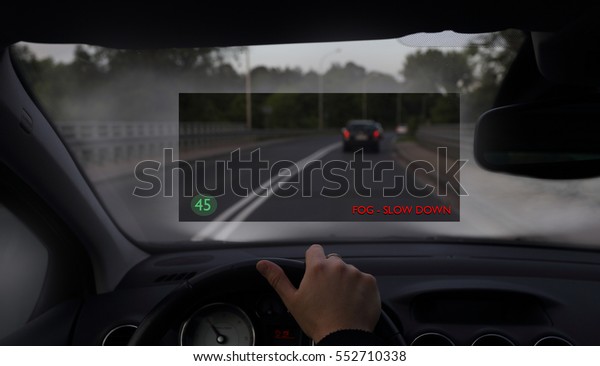 Driving car\
in the fog with a head up display\
system