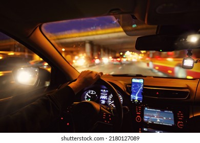 Driving a car at night in the city