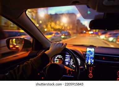 driving a car at night in the city