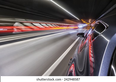 Driving A Car At Night Trough Tunnel