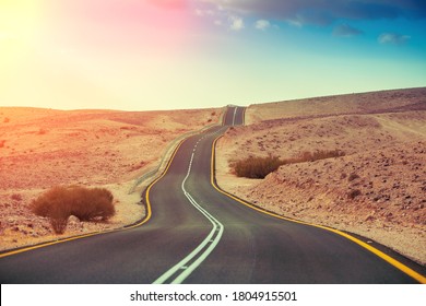 Driving a car on mountain Israel road. Desert landscape. Empty road. View from car of mountain landscape on a sunny day. Israel - Powered by Shutterstock