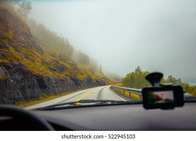 Driving A Car On Mountain Misty Road. Nature Norway.