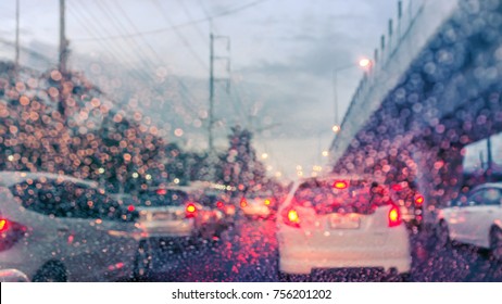 Driving Car On The Road In Trafic Jam With Raindrop Over The Wind Shield, Rainy Season