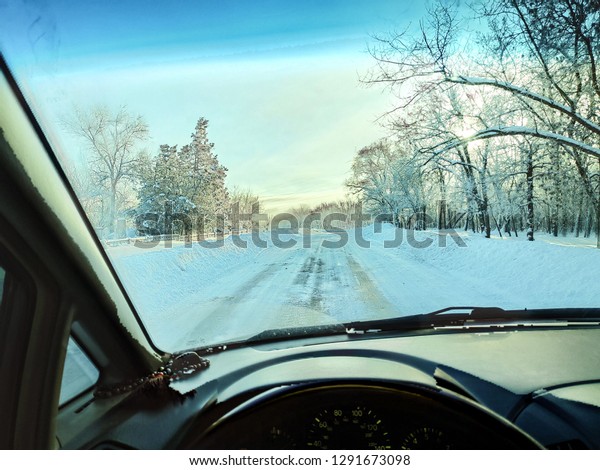 driving in a car on a winter road, winter road,\
inside a car, a lot of\
snow