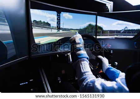 Driving a car in a race simulator
