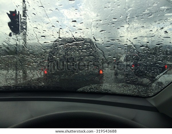 driving car and stuck in\
heavy rainy day