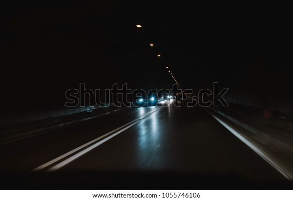 driving a car through
a tunnel in the dark