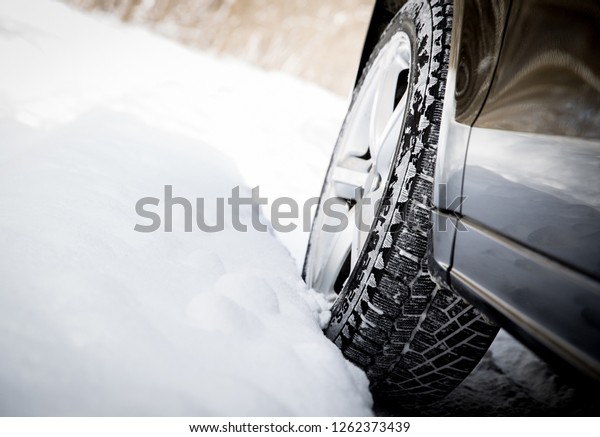 Driving car in winter with\
much snow