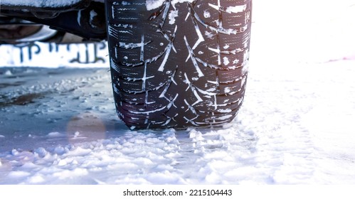 Driving Car With Winter Tire Wheel On Snow Road