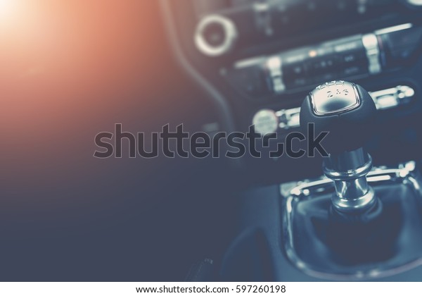 Driving and Cars\
Background Concept with Copy Space. Modern Car Interior with Manual\
Transmission Stick\
Shift.